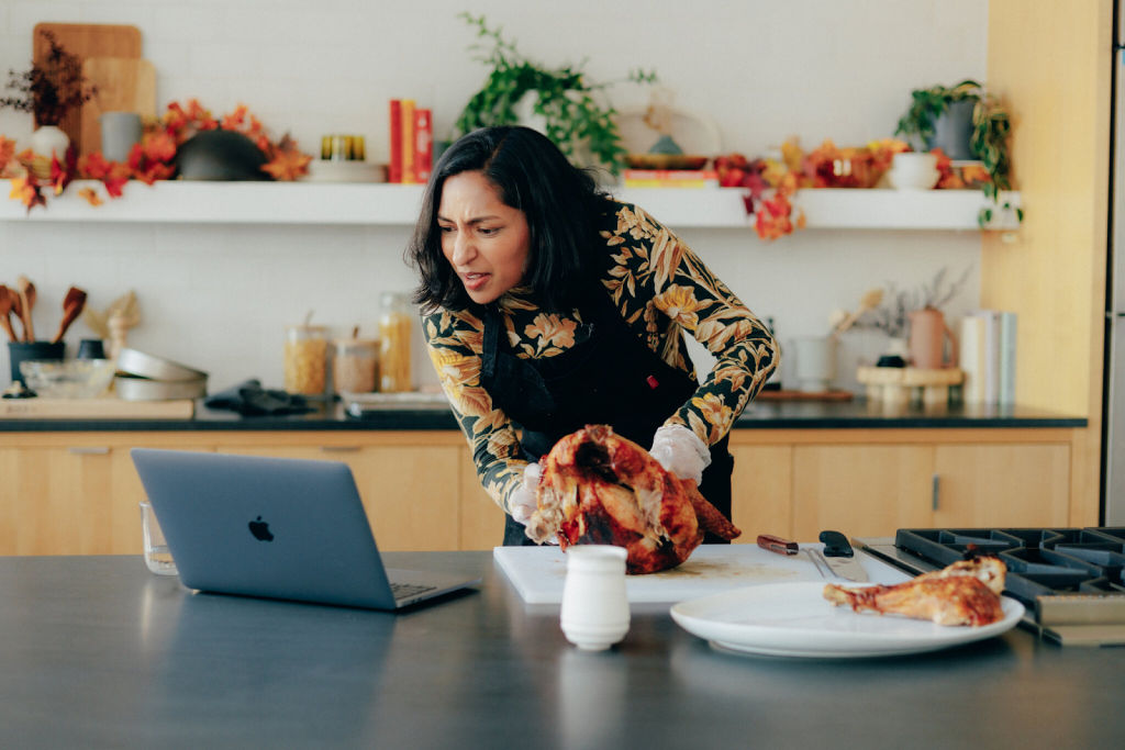 A woman experimenting on different ingredients using an AI recipe maker.